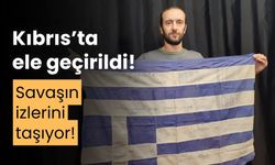 Kıbrıs Barış Harekatı'nda ele geçirilen Yunan bayrağı, savaşın izlerini taşıyor